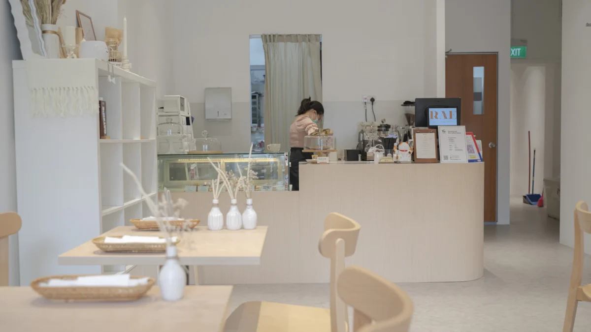 Bright, minimal café interior with counter and seating