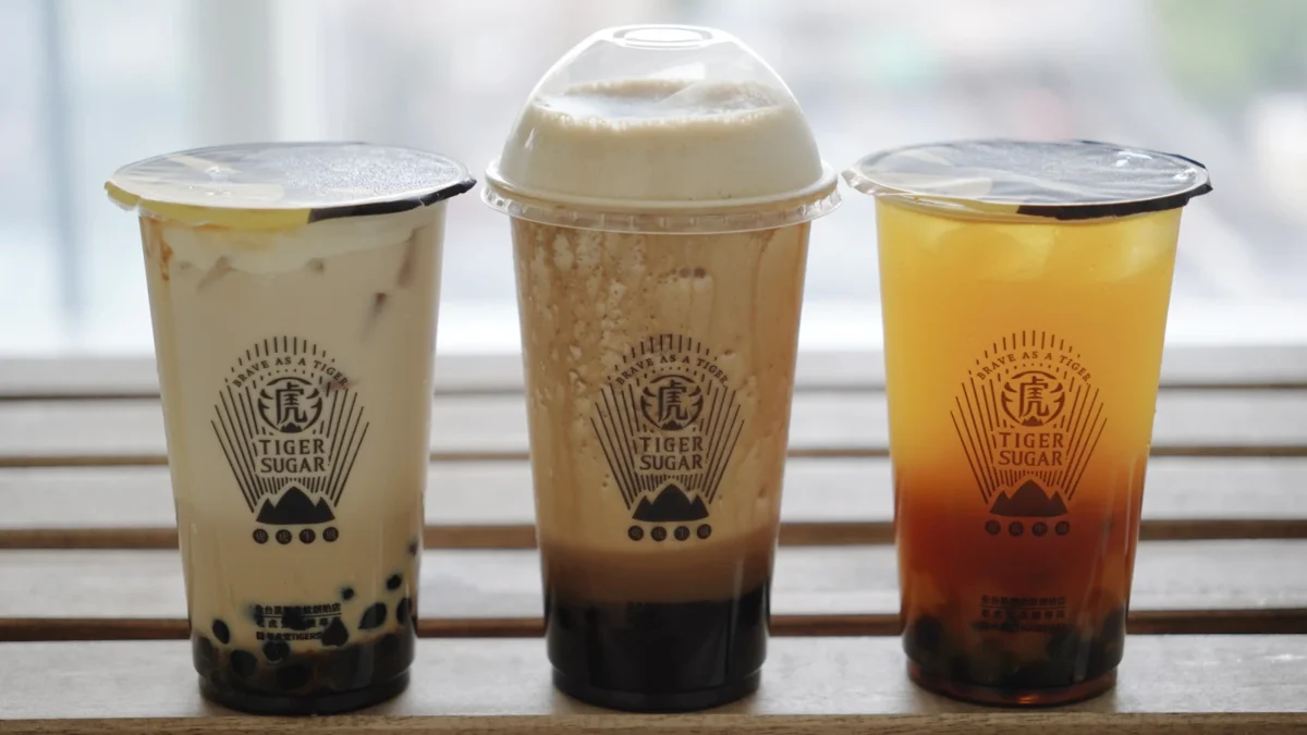 Three cups of bubble tea on a counter