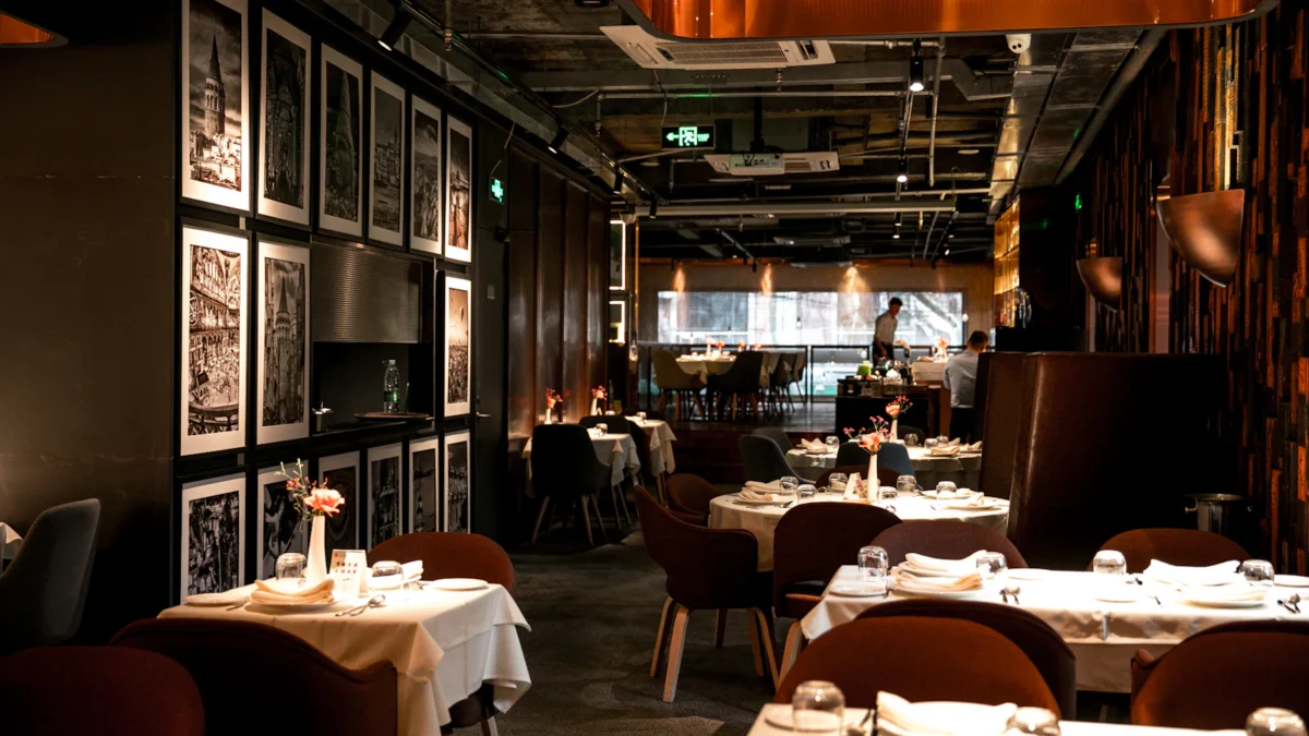 Restaurant dining room with tables set for service